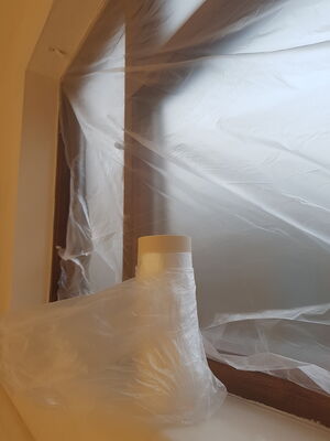 Covermasq masking film being used on a window.