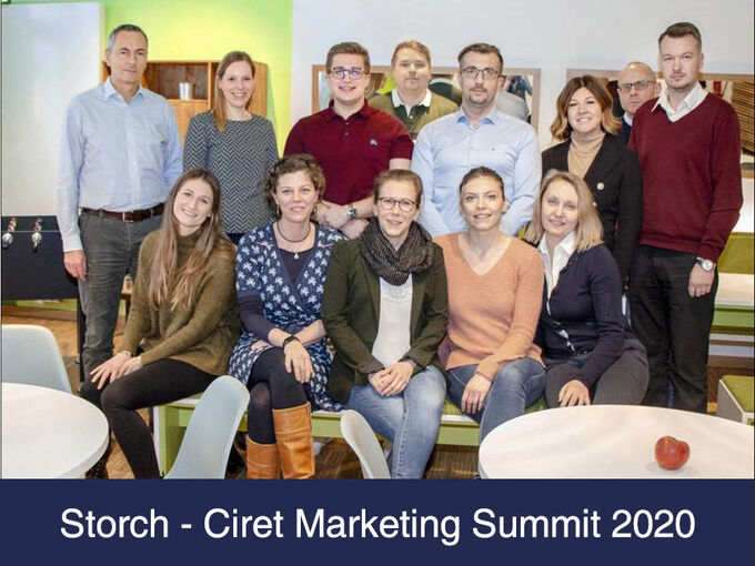Group photo of Storch-Ciret team members at a summit.