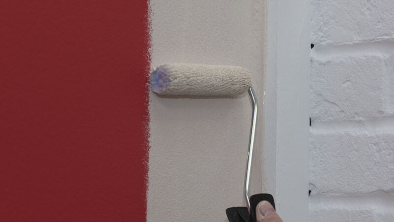 Ciret-ApplicationPhotos-24 A mini paint roller being used to paint a wall white.